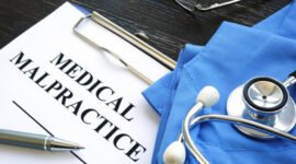 Medical malpractice. Medical suit, stethoscope and documents.