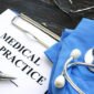 Medical malpractice. Medical suit, stethoscope and documents.
